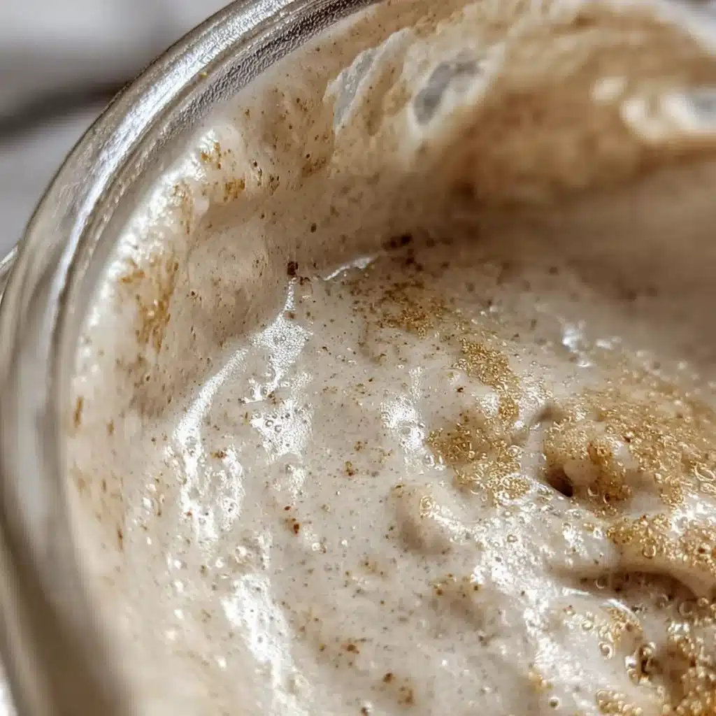 Moldy sourdough starter in a glass jar
