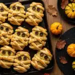 Mummy Garlic Bread – Ultimate Easy Halloween Favorite in 30 Minutes 7 mummy garlic bread recipe with olive eyes and melted cheese
