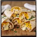 Cheesy garlic chicken wraps with melted cheese and fresh ingredients