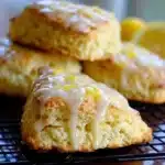 Freshly baked zesty lemon scones on a cooling rack
