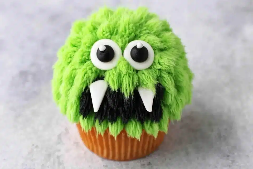 Colorful Halloween Monster Cupcakes decorated with spooky designs for Halloween.