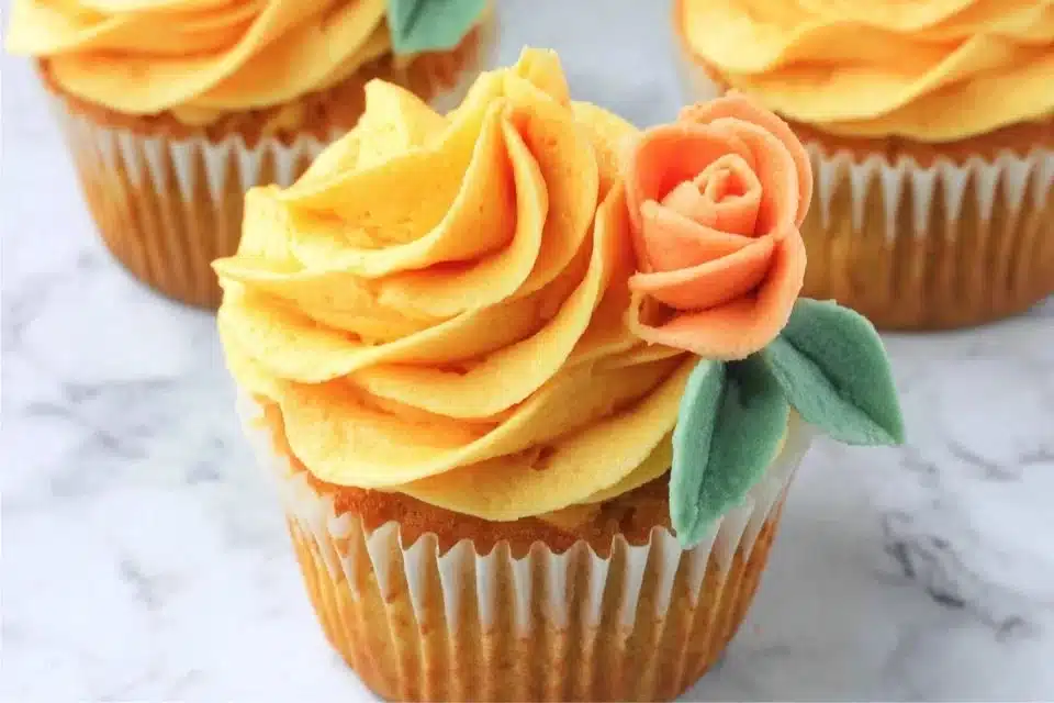 Easy pumpkin cupcakes decorated with buttercream leaves for autumn.