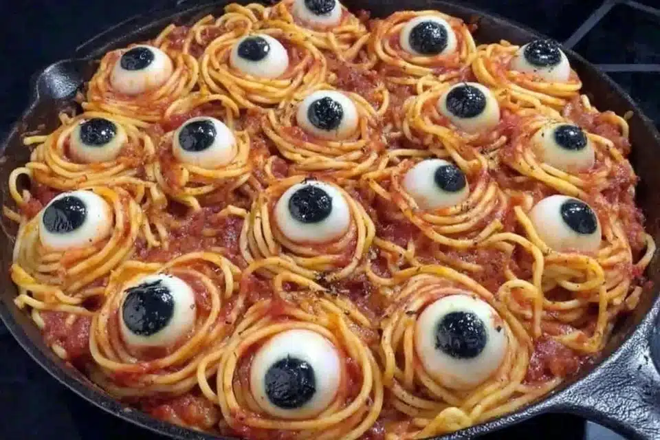 Plate of creepy spaghetti eyeballs served for Halloween.