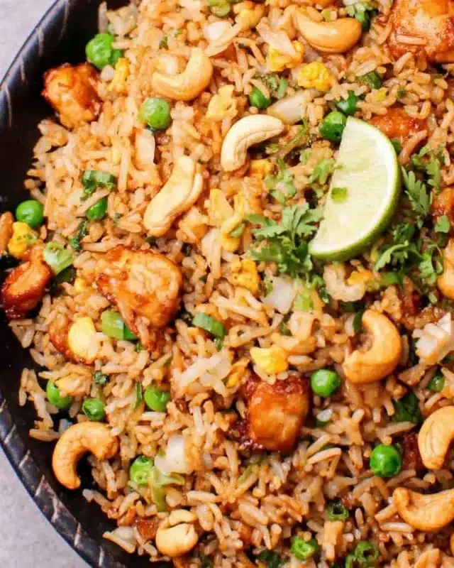 Easy chicken fried rice with sriracha and cashews in a bowl