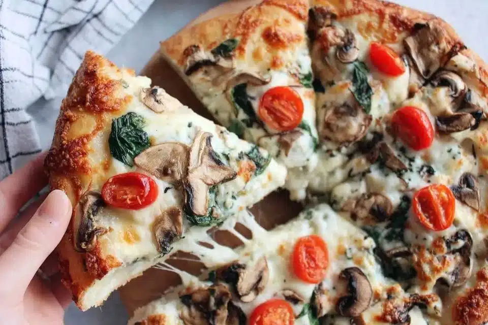 Easy flatbread pizza topped with fresh spinach and mushrooms