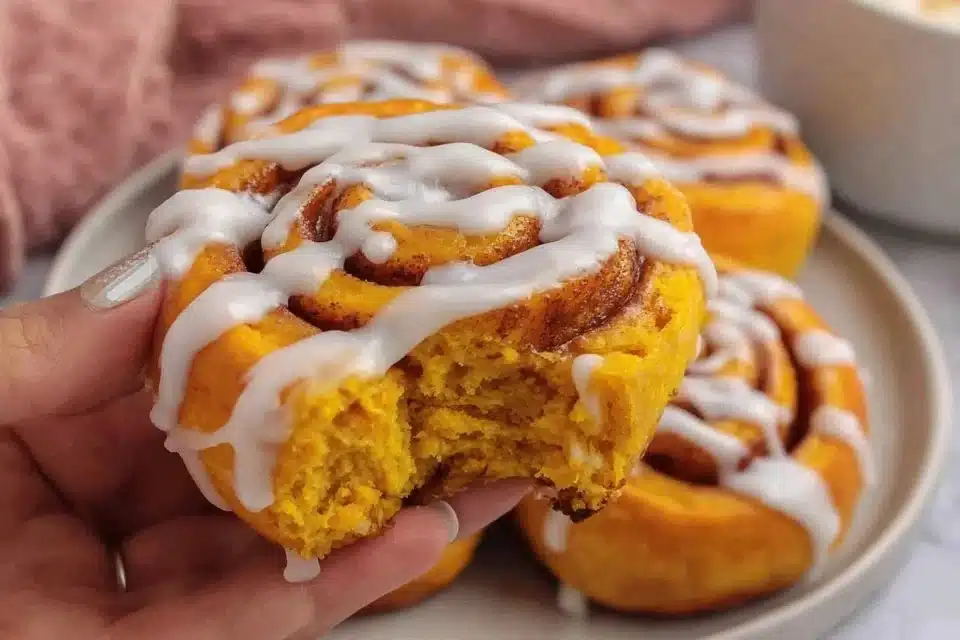 Easy Pumpkin Cinnamon Rolls No Yeast Needed: A Journey of Flavor and Comfort 3 Delicious easy pumpkin cinnamon rolls without yeast, drizzled with icing.