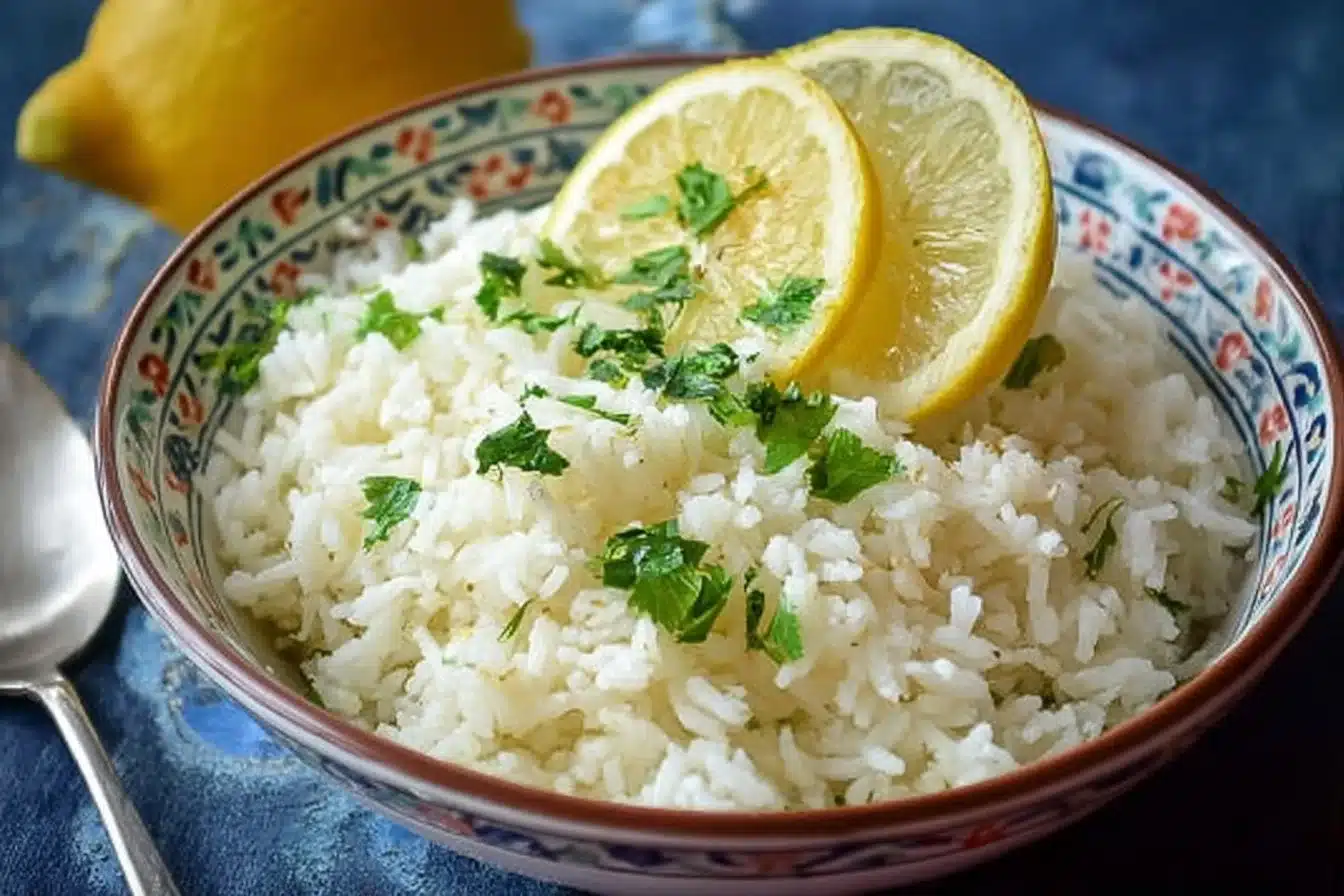 Delicious Greek Lemon Rice 3 Delicious Greek Lemon Rice served in a bowl garnished with herbs