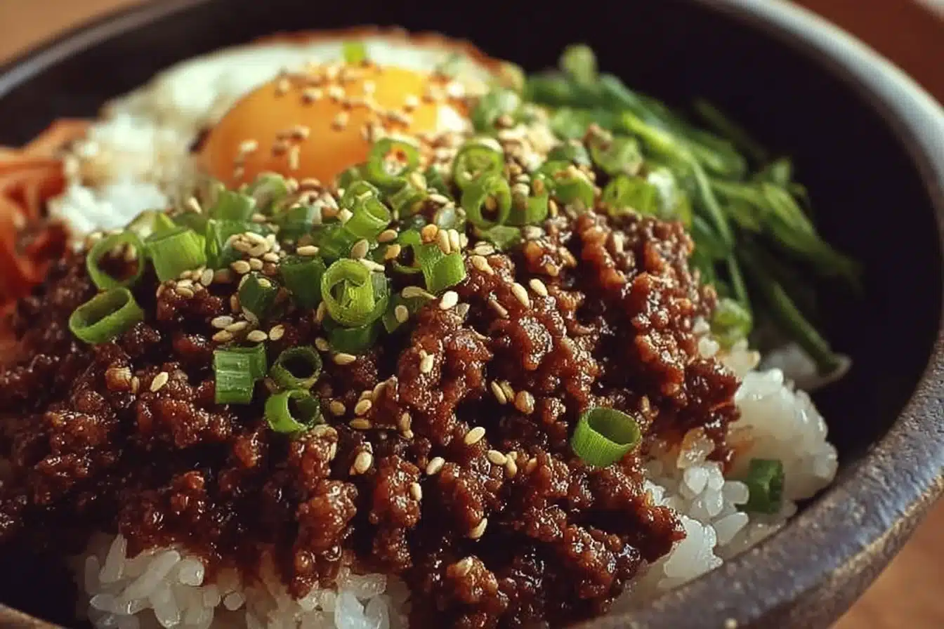 Korean Ground Beef Bowl with vegetables and sauce served in a bowl