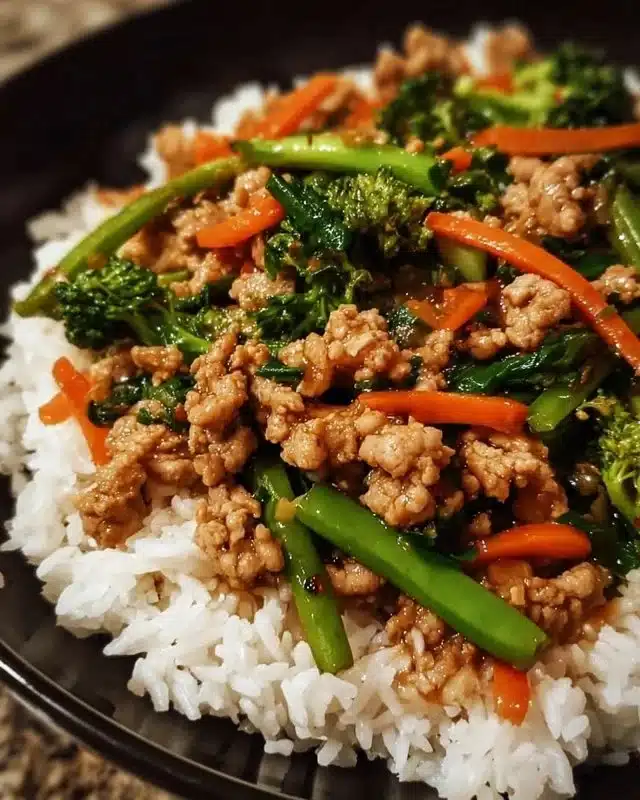 Ground turkey teriyaki stir fry with colorful vegetables in a skillet.