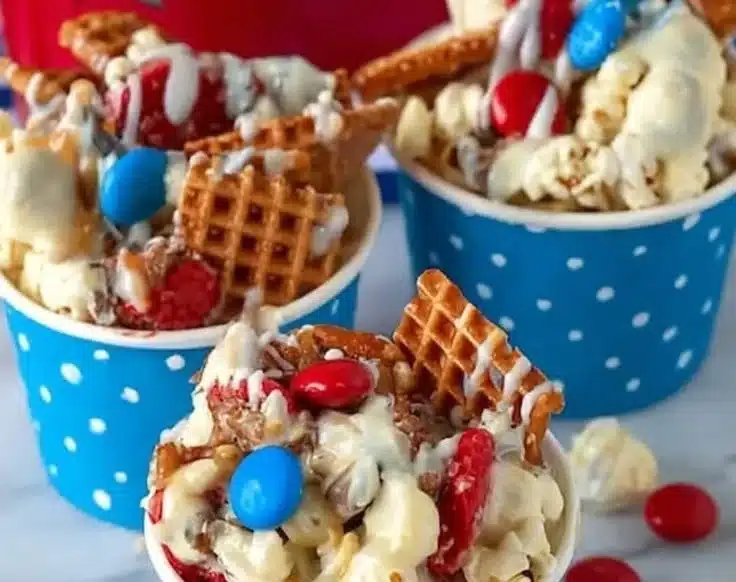 Colorful 4th of July candy snack mix with red, white, and blue treats.
