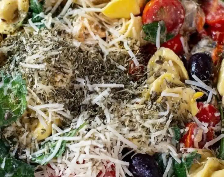 Italian tortellini pasta salad with fresh vegetables and dressing