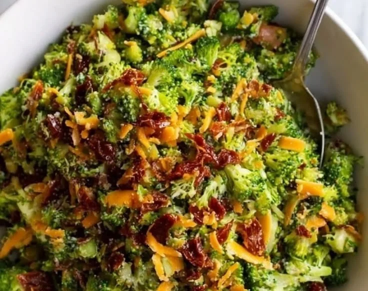Skillet Garlic Bacon and Broccoli dish garnished with herbs