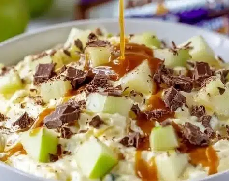 Delicious Snickers Salad with chocolate, caramel, and fresh fruit