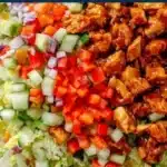 Hot Honey Chicken Salad featuring tender chicken, greens, and a spicy honey dressing.
