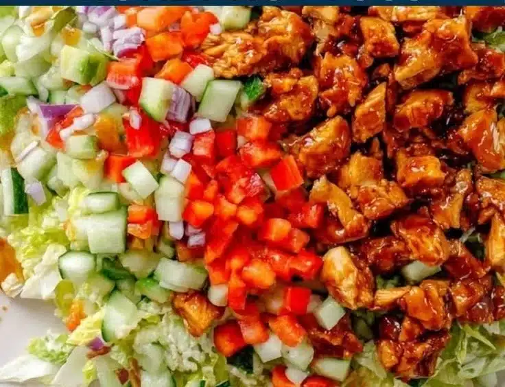 Hot Honey Chicken Salad featuring tender chicken, greens, and a spicy honey dressing.
