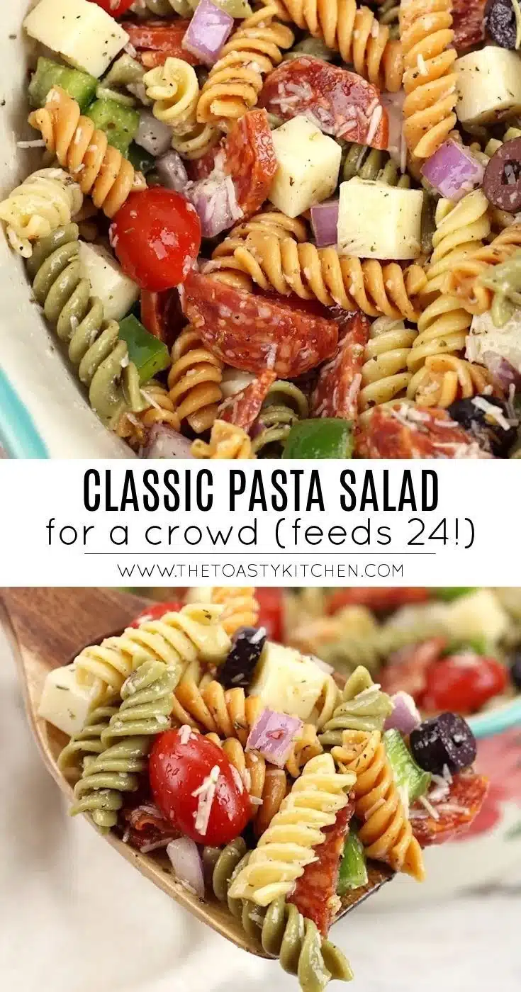 A vibrant bowl of classic pasta salad with colorful vegetables and dressing.